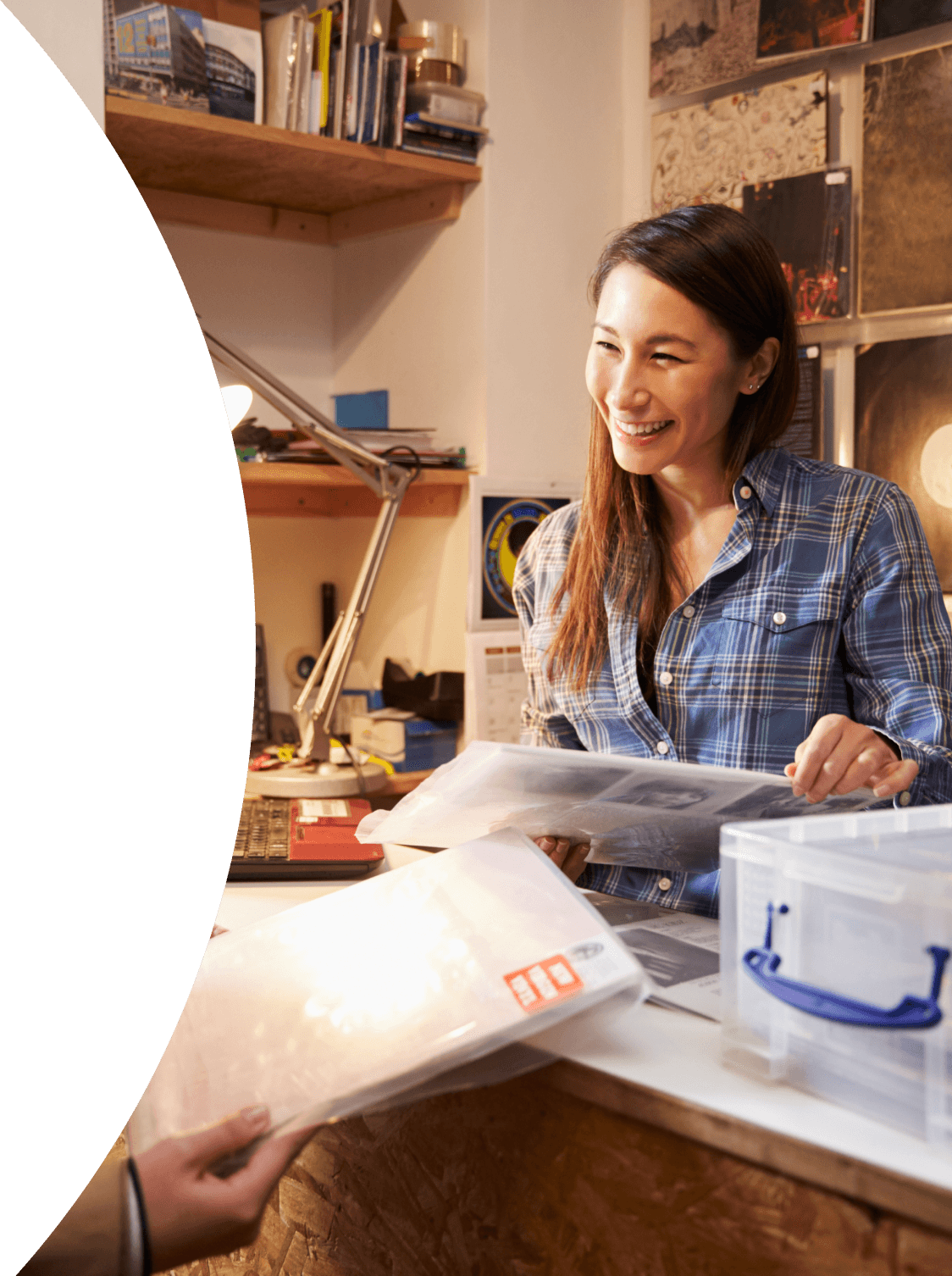 image of lady smiling at her desk