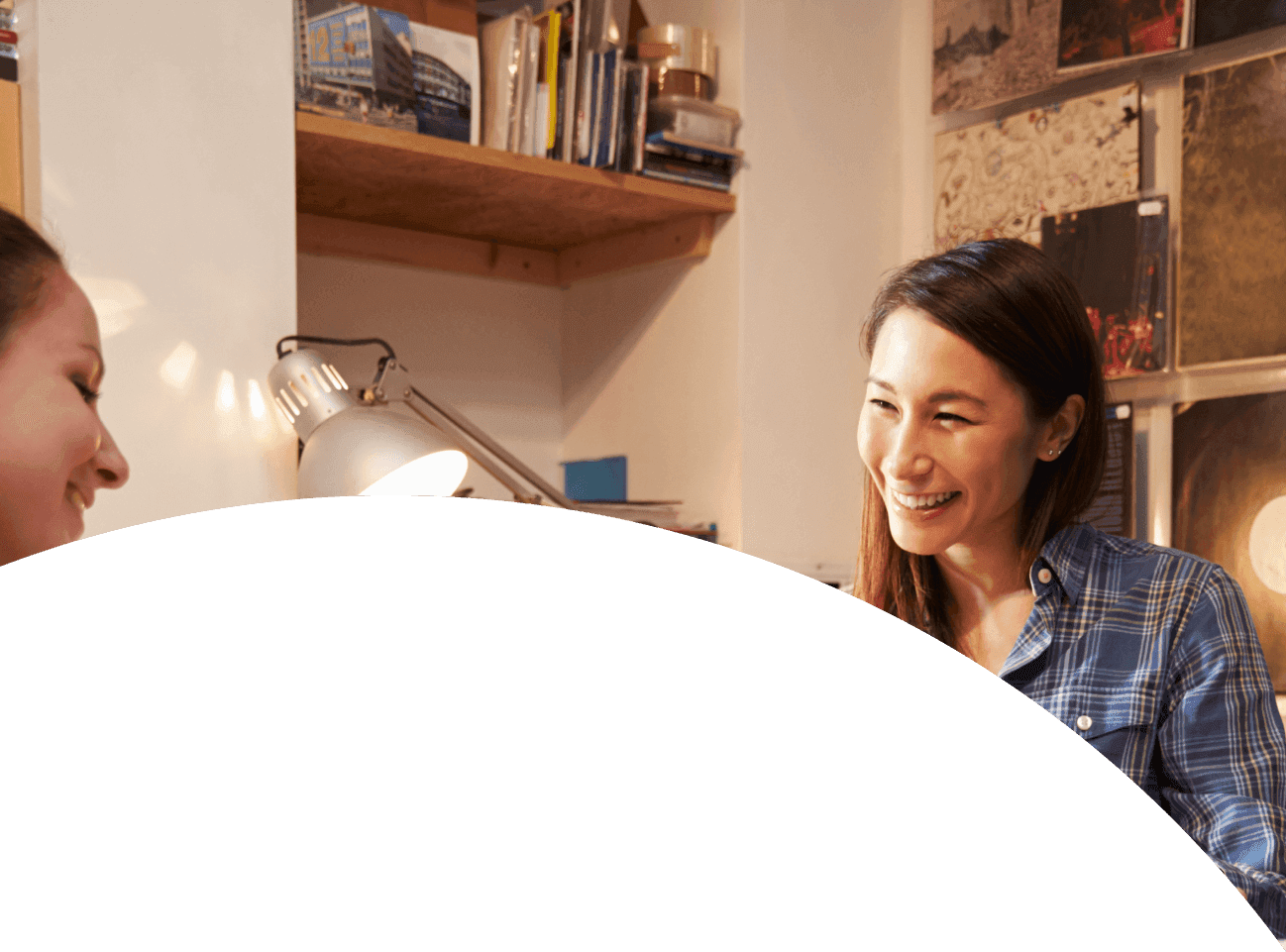 image of lady smiling at her desk
